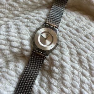 Swatch Stainless Steel Skin Watch: waterproof, Swiss made.